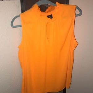 Sleeveless orange blouse